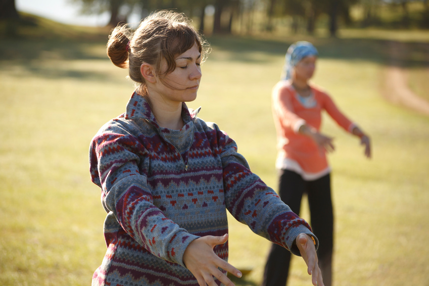 Fotolia: Two women are practicing Qi Gong